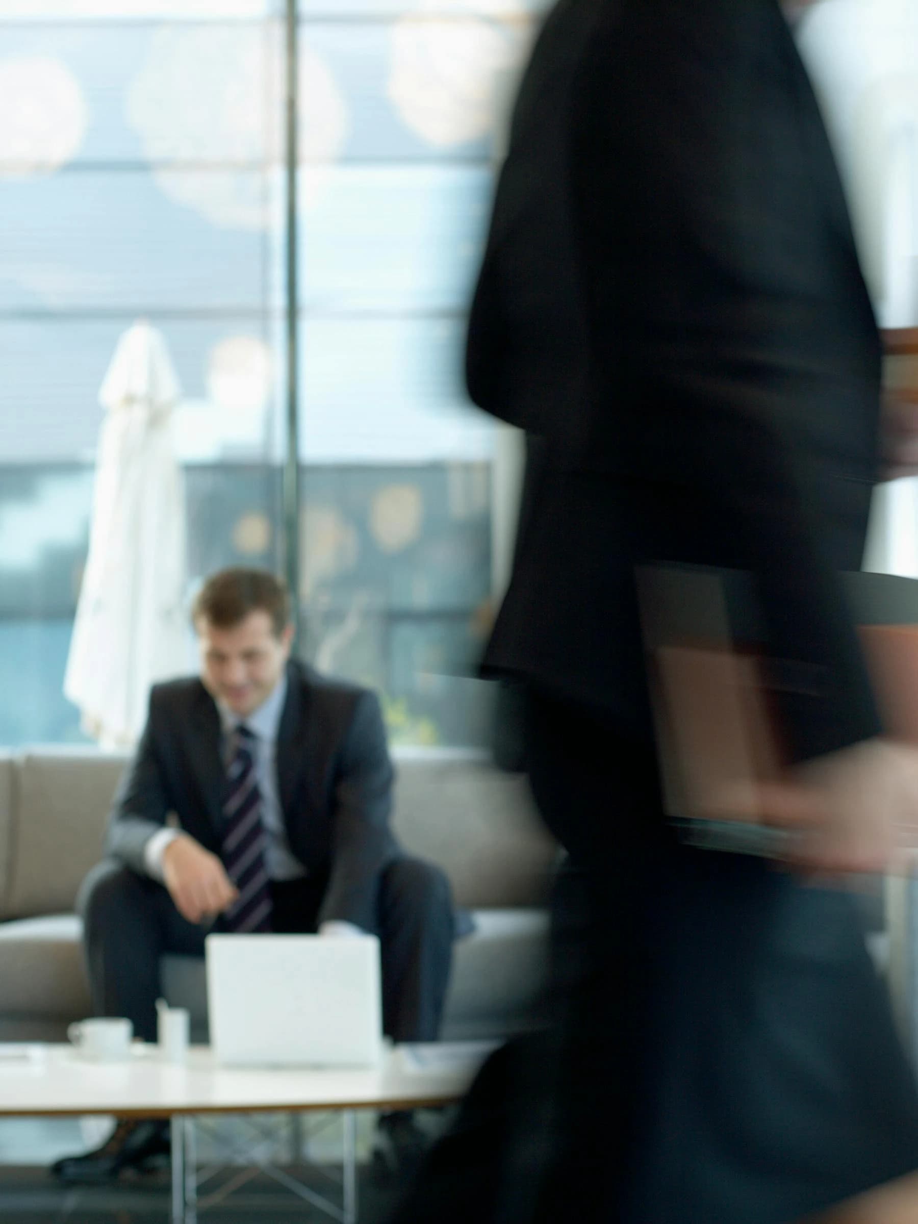 Businessman in a suit sitting in a lounge